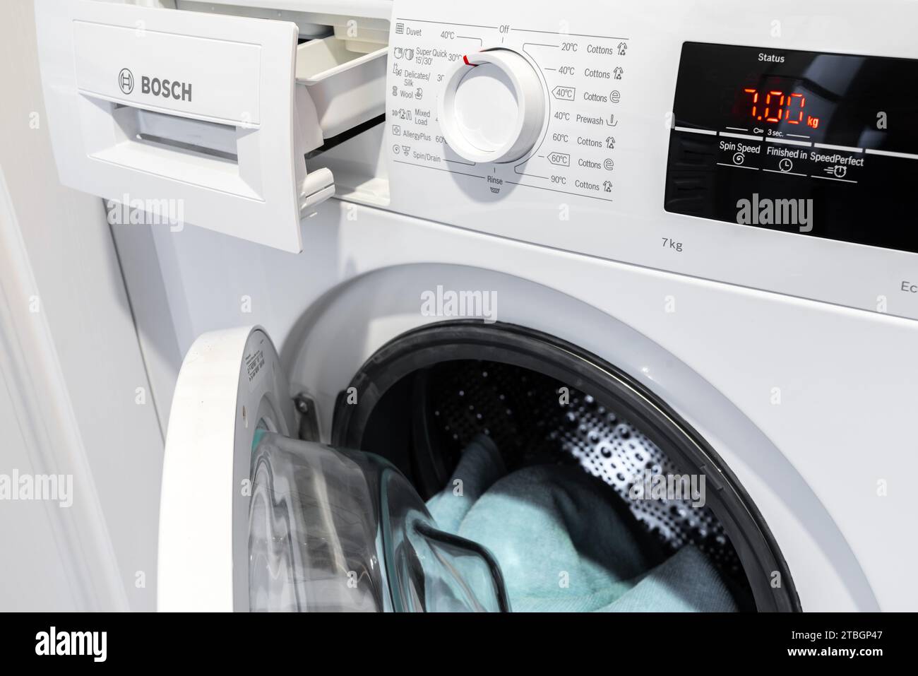 Wash clothes in a Bosch washing machine Stock Photo Alamy