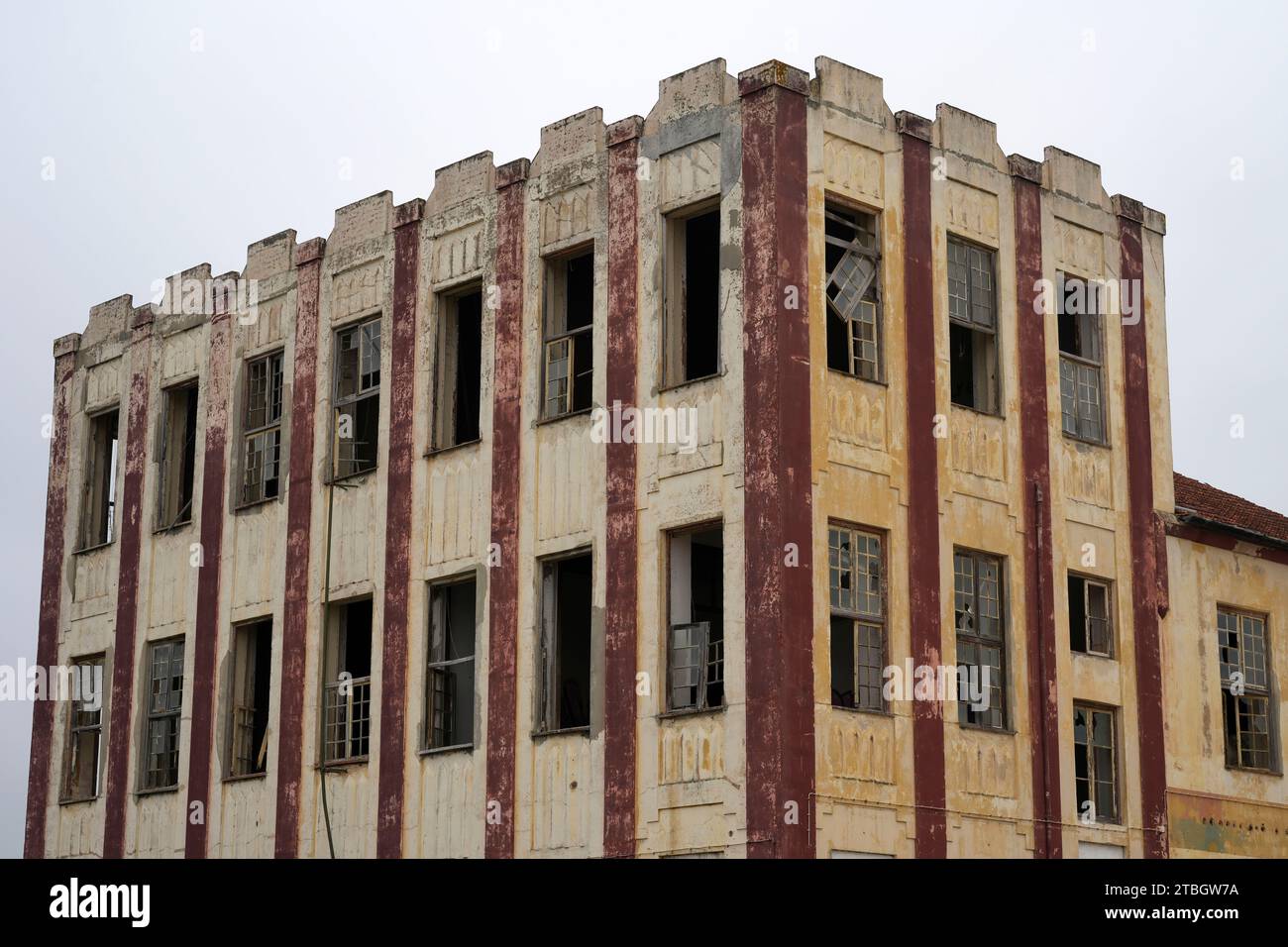 Dilapidated old building with broken windows Stock Photo
