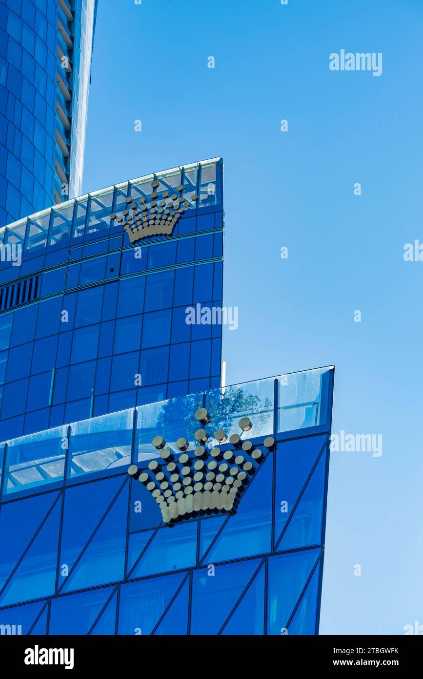 Looking up at the curved glass exterior and logo of the Crown Sydney hotel and Casino at North Barangaroo in Sydney, Australia Stock Photo