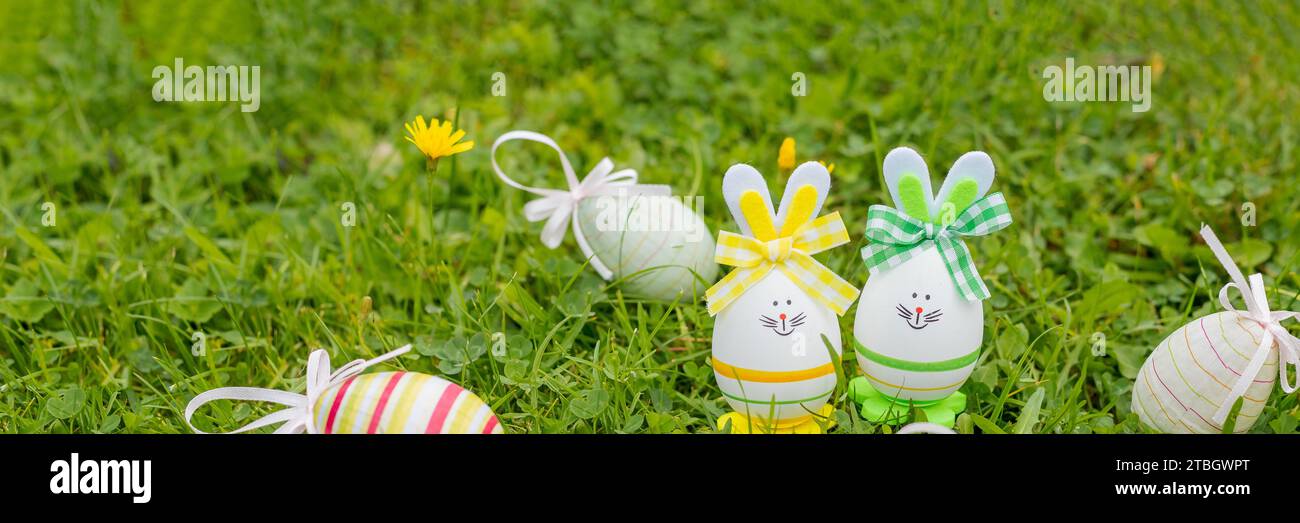 Easter object. colored hand painted easter eggs and decorative rabbits are symbols of the holiday. composition on a light background Stock Photo