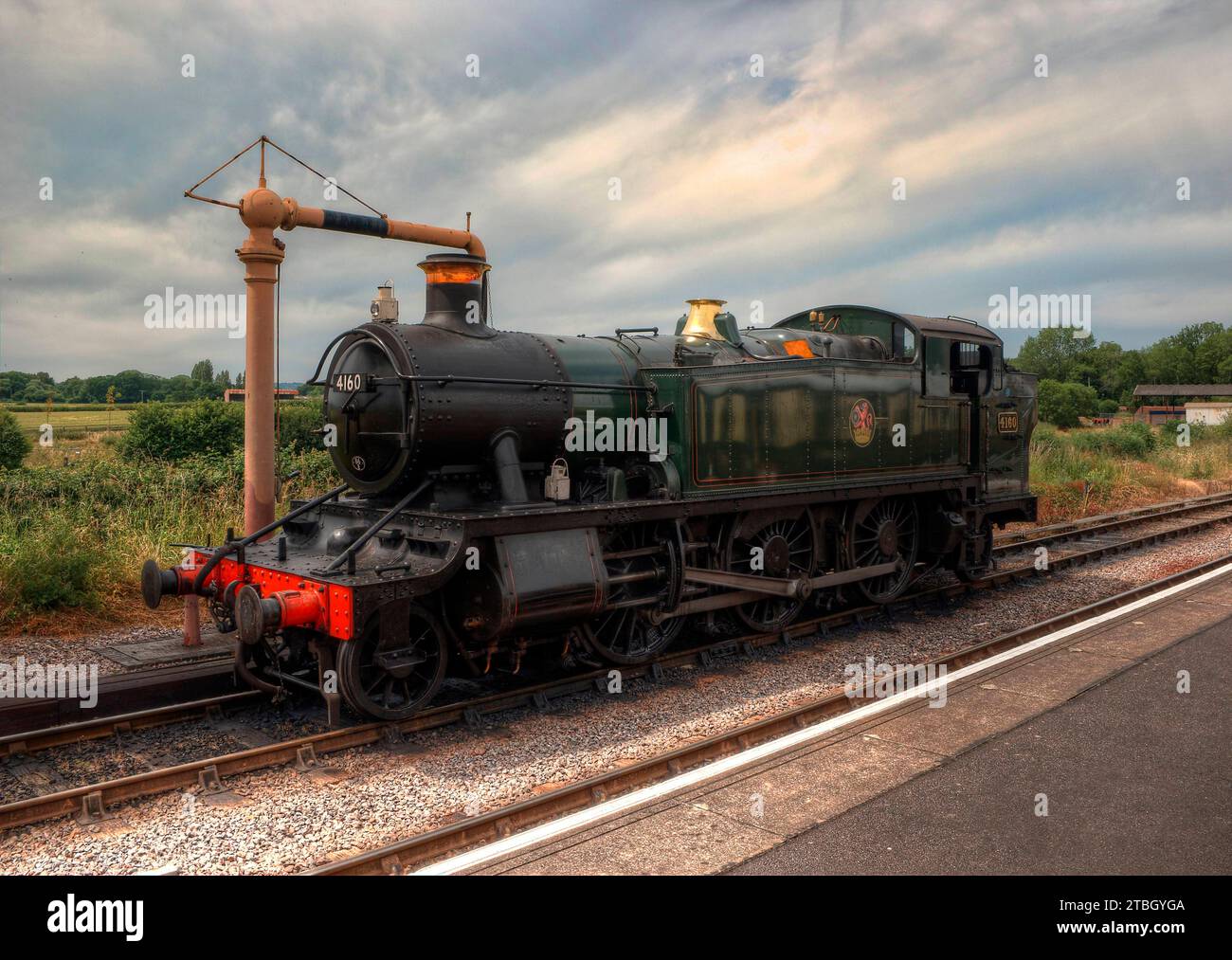 4160 Steam train taking on water at Lydeard Station Stock Photo