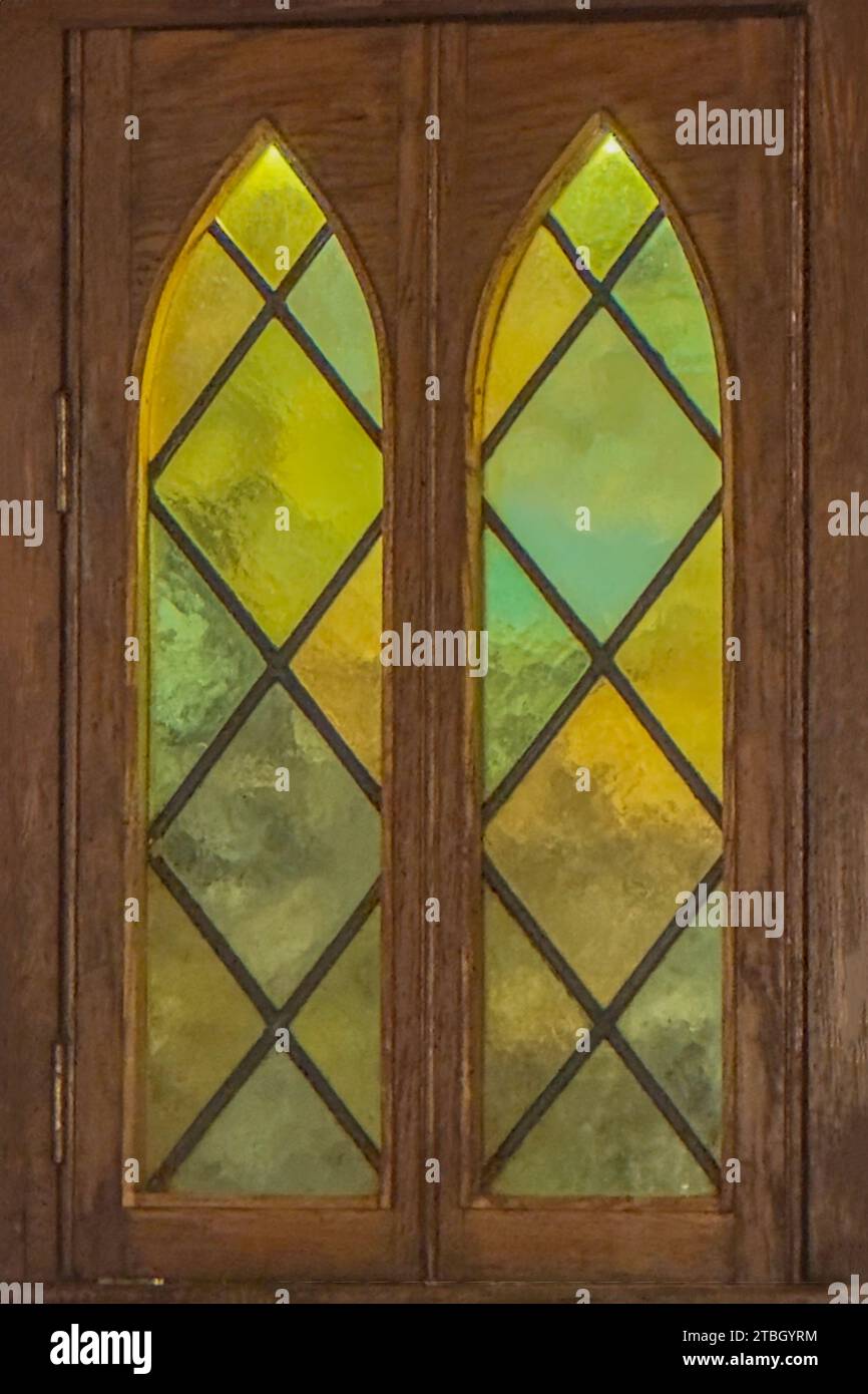 green and yellow stained glass window Stock Photo