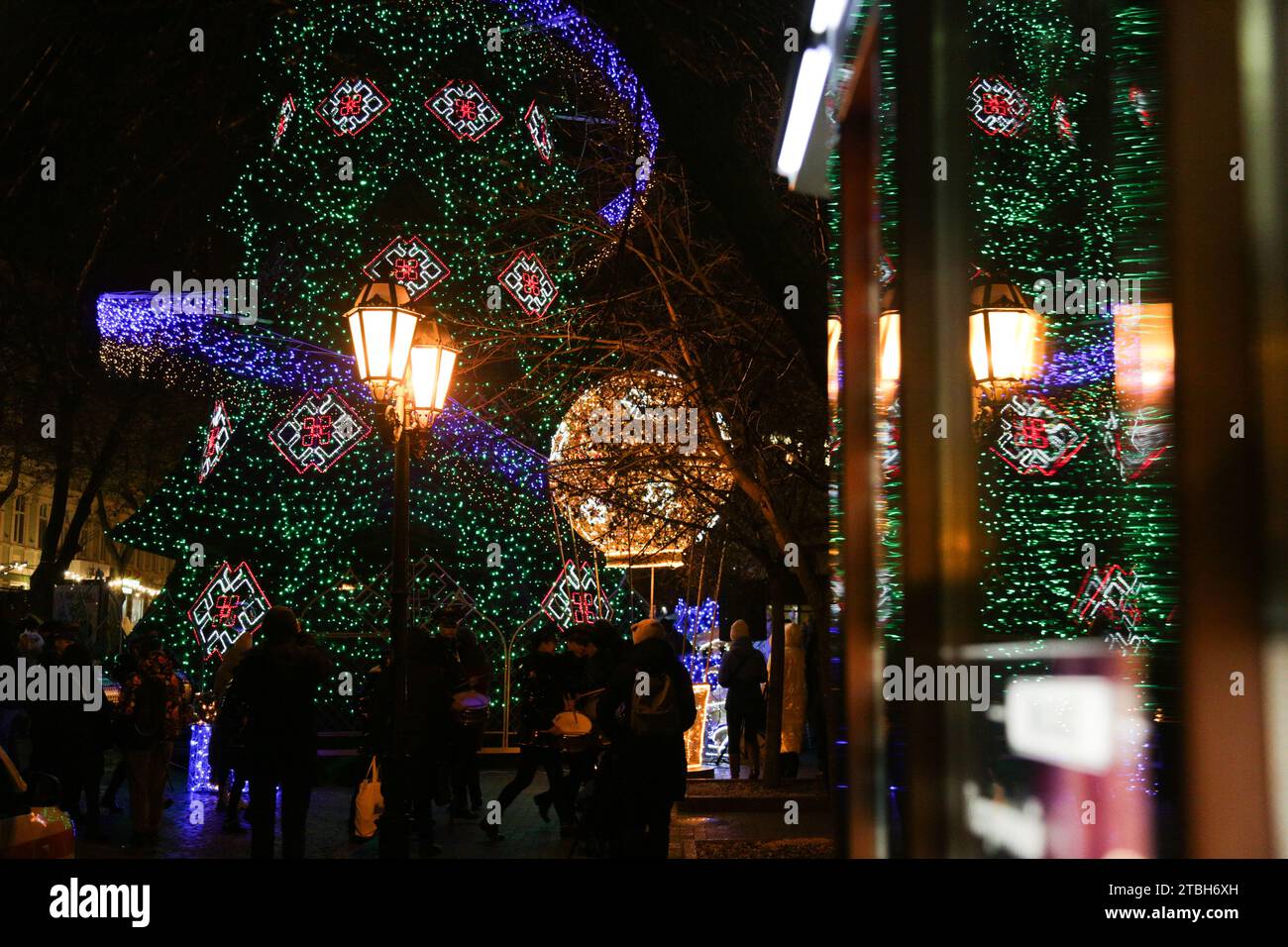 Odessa, Ukraine. 06th Dec, 2023. People walk near the Christmas tree on