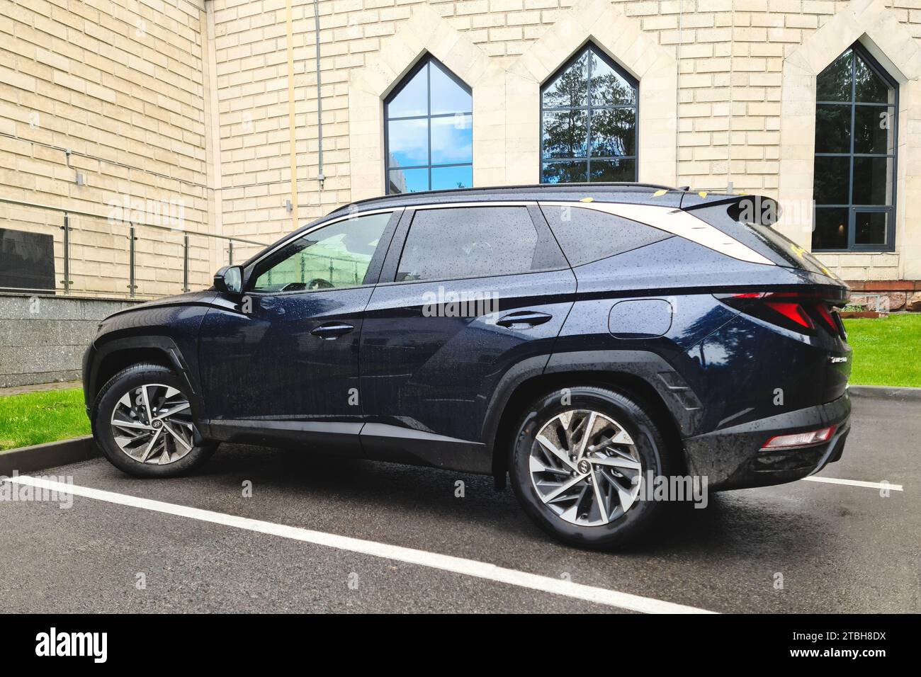 A blue four-wheel drive Hyundai Tucson crossover is parked near the ...