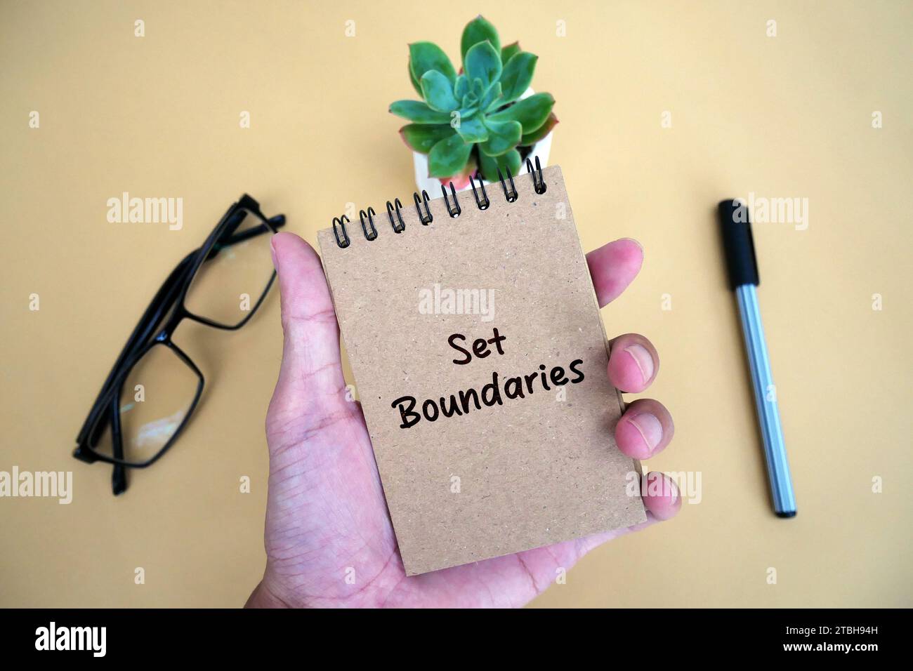 Top view of a white notebook with text of set boundaries. Stock Photo