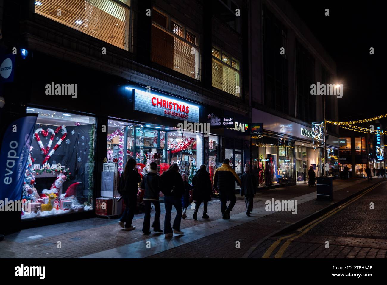 Shops at night in Southend on Sea High Street with Christmas lights. Shopping precinct. Christmas Supermarket seasonal store Stock Photo