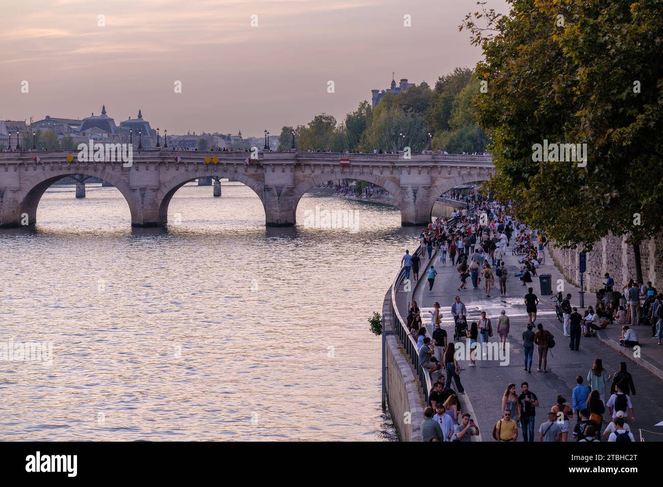 Paris, France - October 8, 2023 : View of tourists and Parisians walking next to the river Seine in Paris France Stock Photo