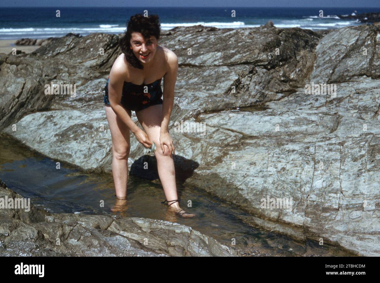 1958 Newquay, a young woman bathing on rocks   Photo by Tony Henshaw Archive Stock Photo