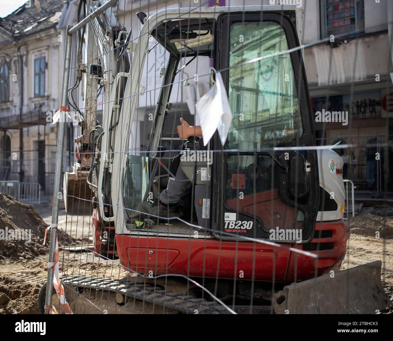 Belgrade, Serbia, Oct 18, 2023: A backhoe operating at a street reconstruction site in Zemun Stock Photo