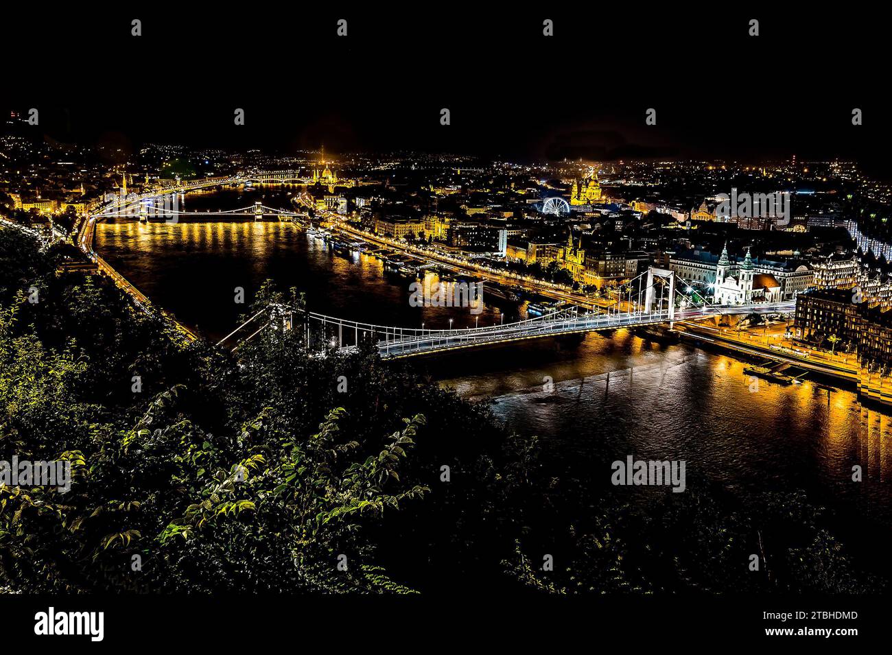 The River Danube lit up at night in Budapest in summertime Stock Photo