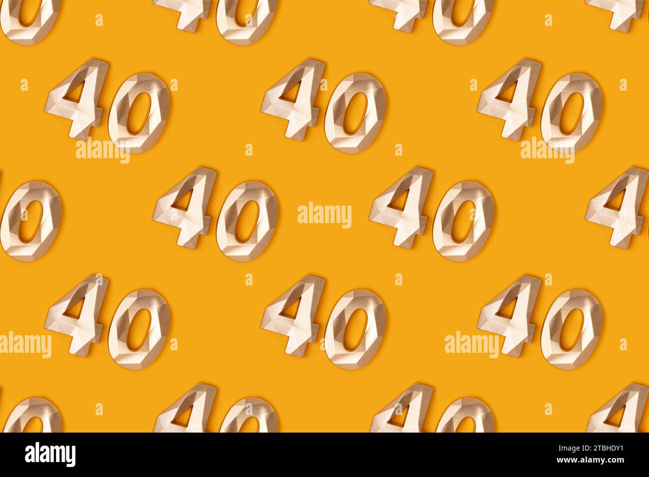 Repetitive pattern made of golden number 40 on a yellow background. Stock Photo