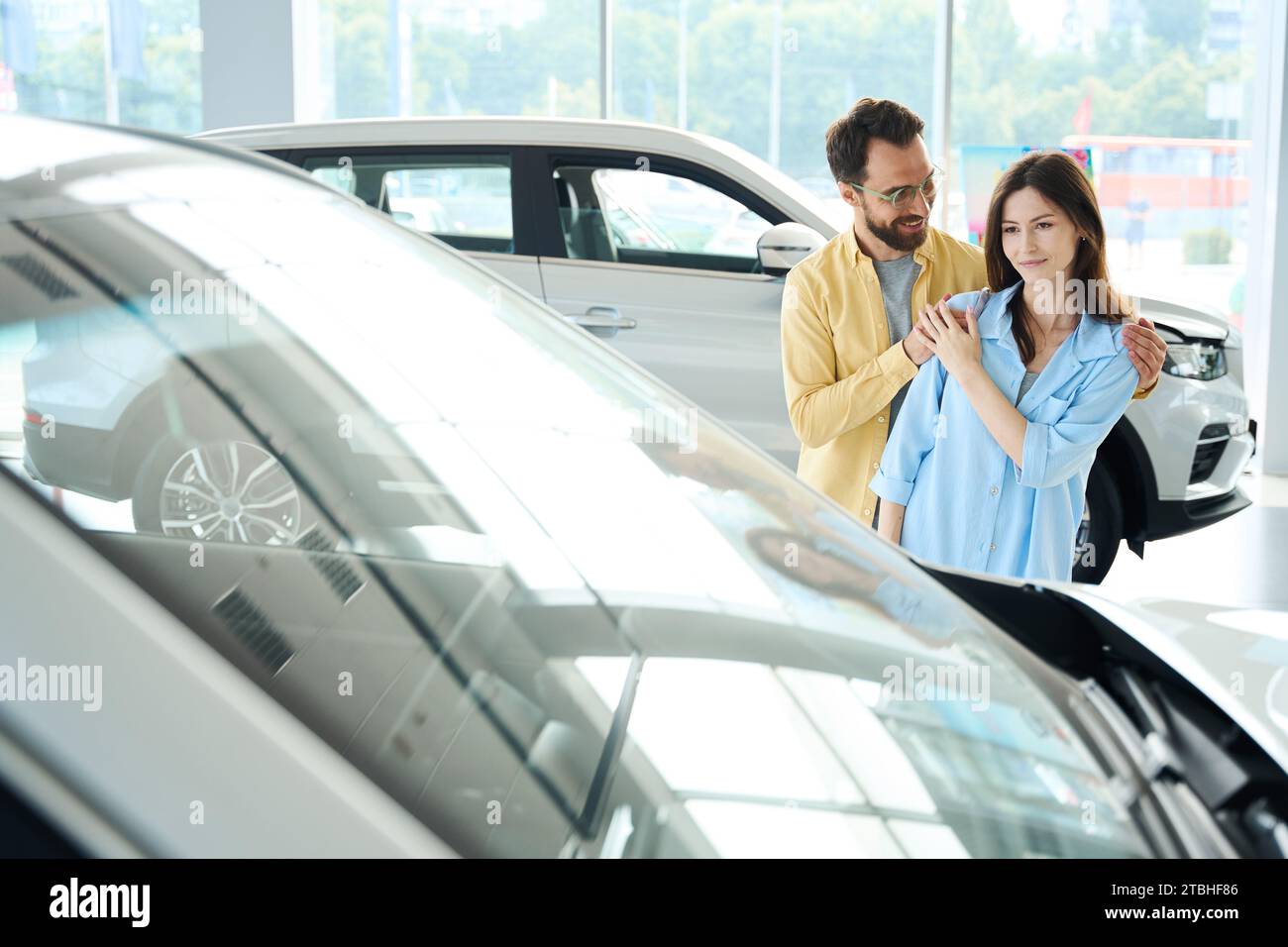 Happy man hug new car hi-res stock photography and images - Alamy