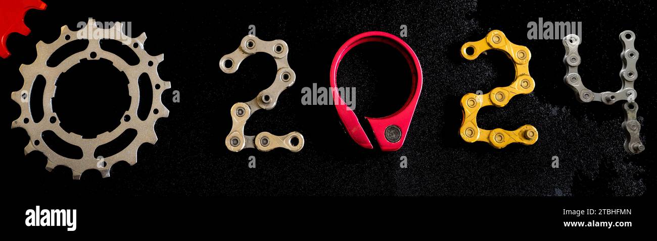Bicycle parts concept for Happy New Year 2024 Stock Photo