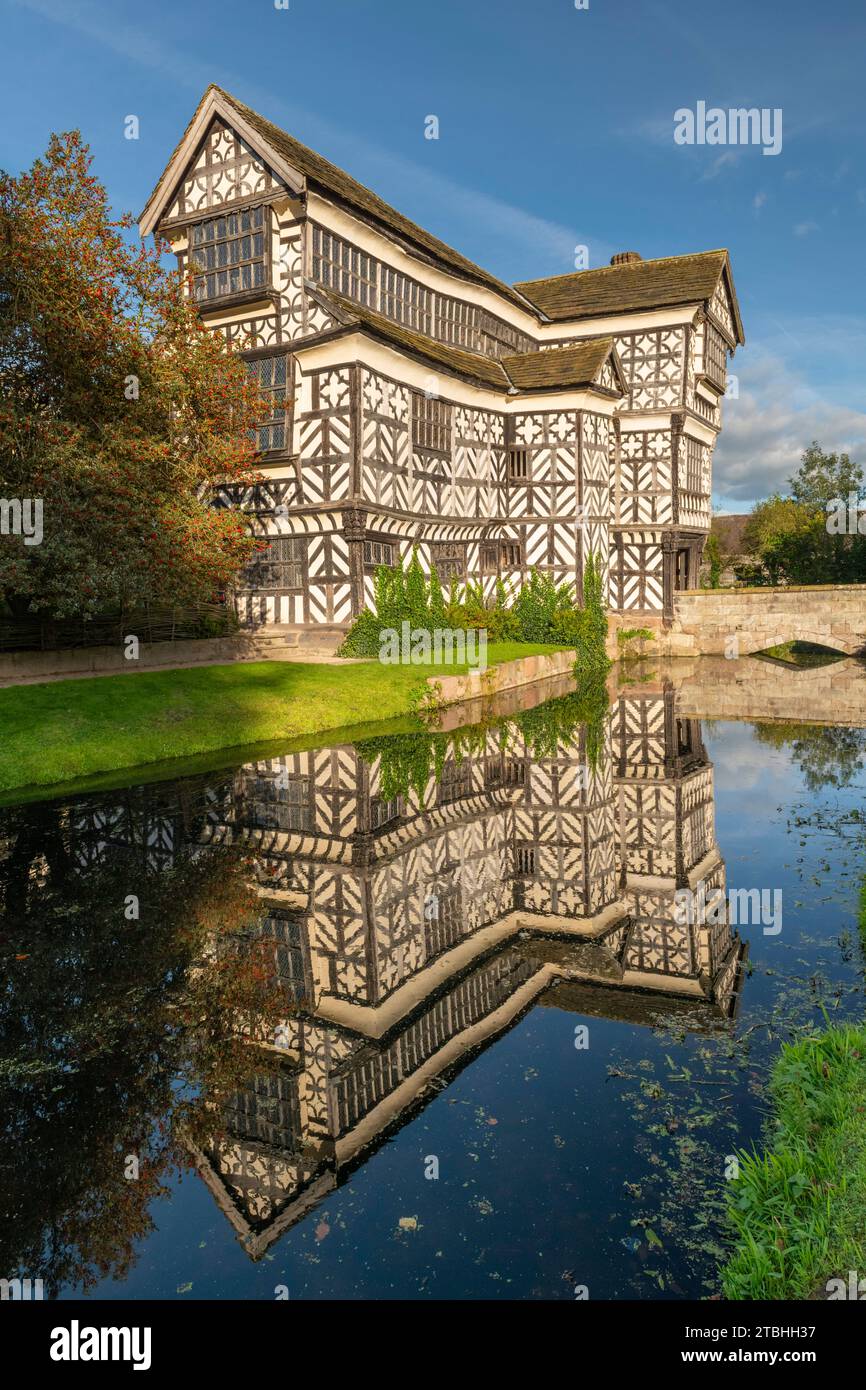 Tudor manor Little Moreton Hall, reflected in its moat, Congleton, Cheshire, England.  Autumn (October) 2023. Stock Photo