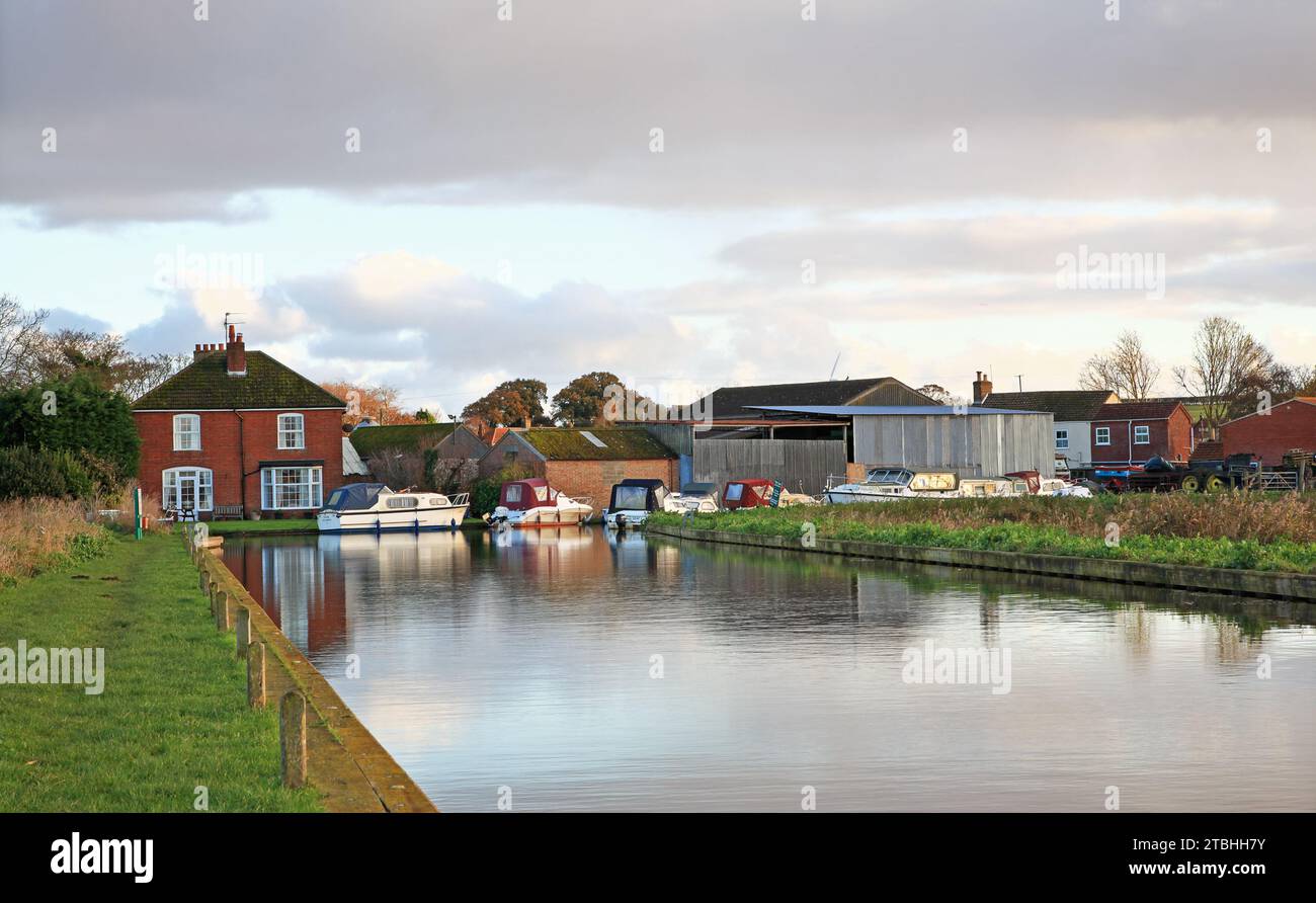 A view of dyke leading to the Staithe and small boatyards on the Norfolk Broads east of Martham at West Somerton, Norfolk, England, United Kingdom. Stock Photo