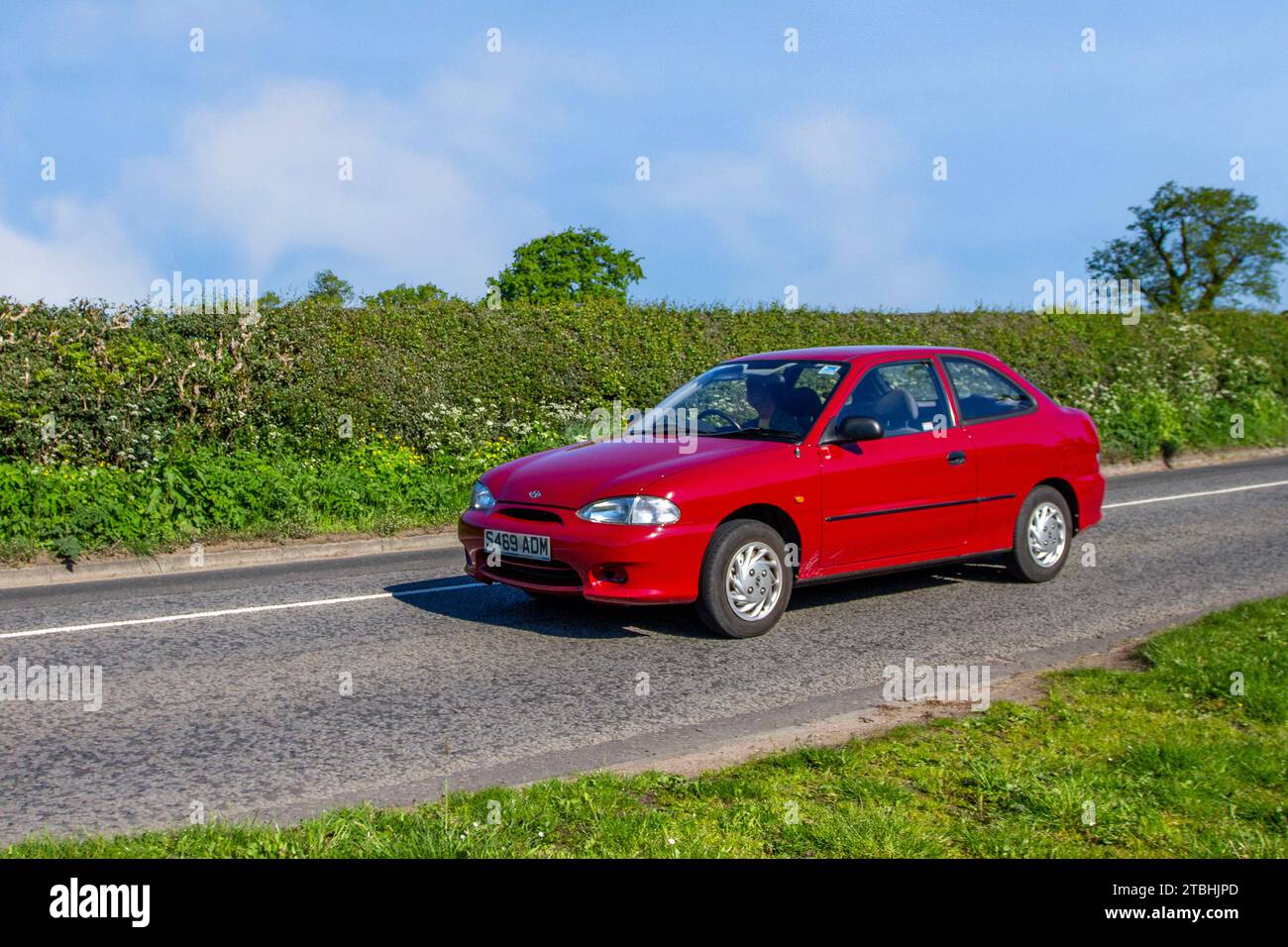 1998 90s nineties Hyundai Accent Coupe; Vintage, restored classic motors, automobile collectors motoring enthusiasts, historic veteran cars travelling in Cheshire, UK Stock Photo