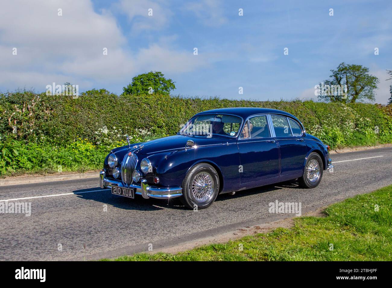 1963 60s sixties Blue Jaguar 3.4/340 luxury British 3442 cc  Mk2 saloon car; Vintage, restored classic motors, automobile collectors motoring enthusiasts, historic veteran cars travelling in Cheshire, UK Stock Photo