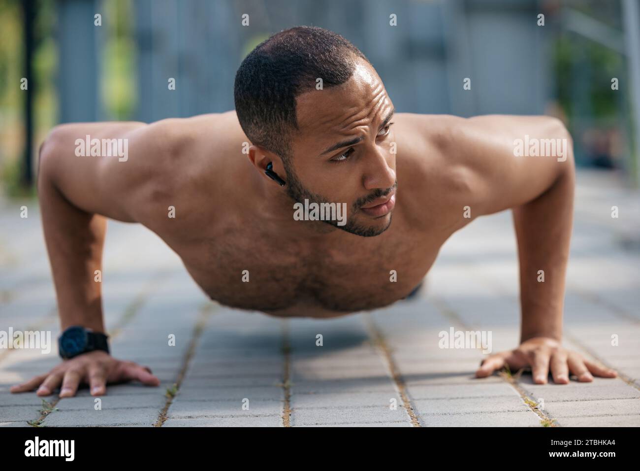 Strong muscular handsome man doing push ups Stock Photo - Alamy