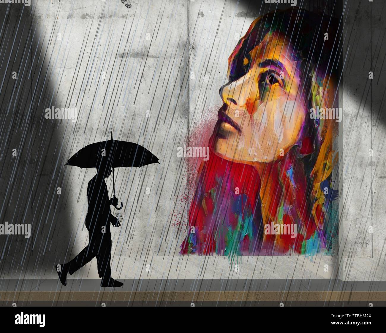 Public street art is on a wall as a pedestrian with umbrella passes by ...