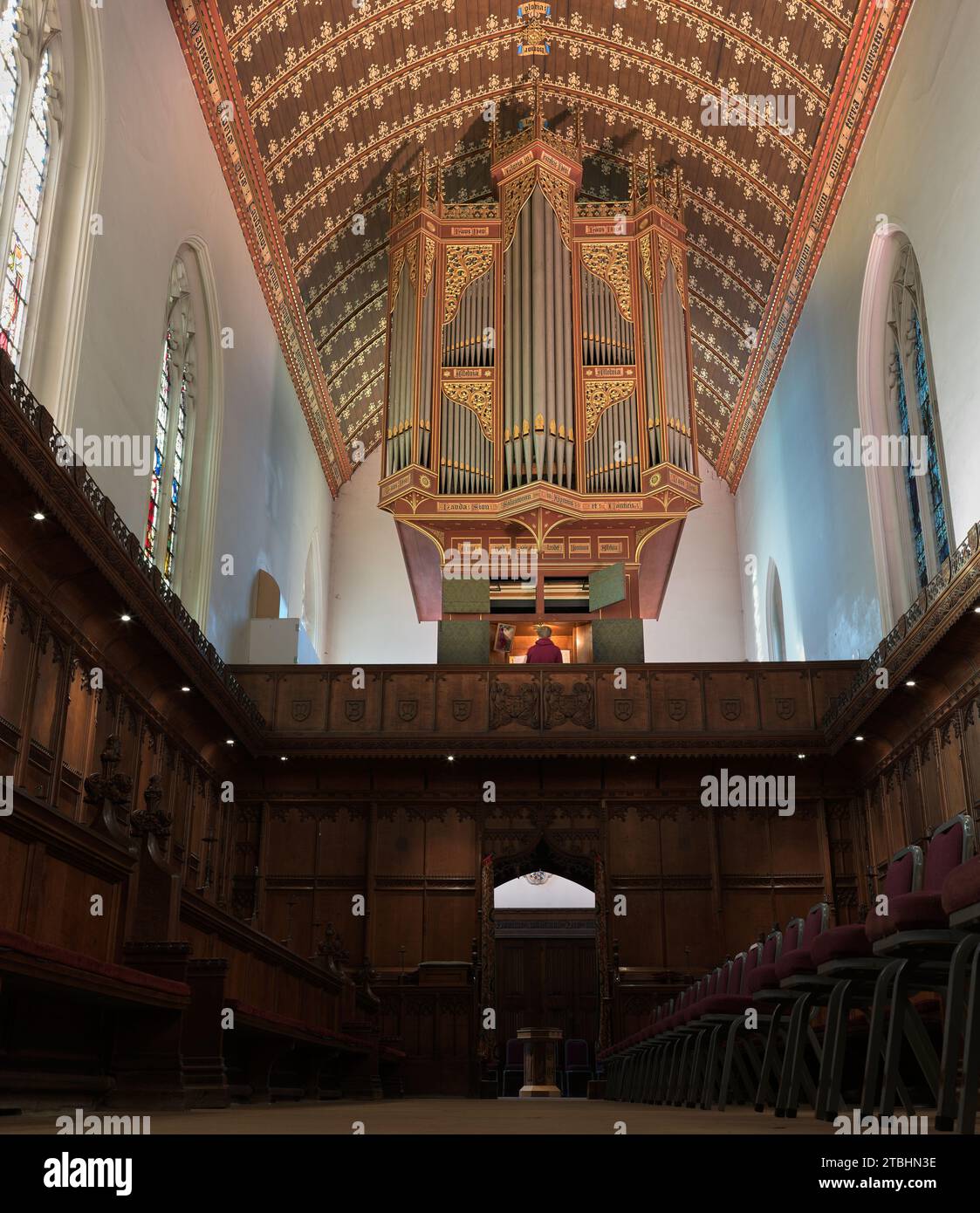 Organ pipes and decorated ceiling at chapel at Queens' College, University of Cambridge, England. Stock Photo