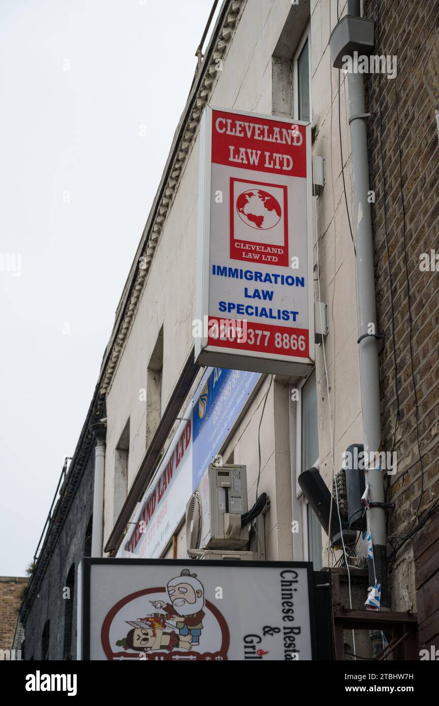 Sign on wall at front of Cleveland Law Ltd, an immigration law specialist practice on Brick Lane, Spitalfields, London, England, UK Stock Photo