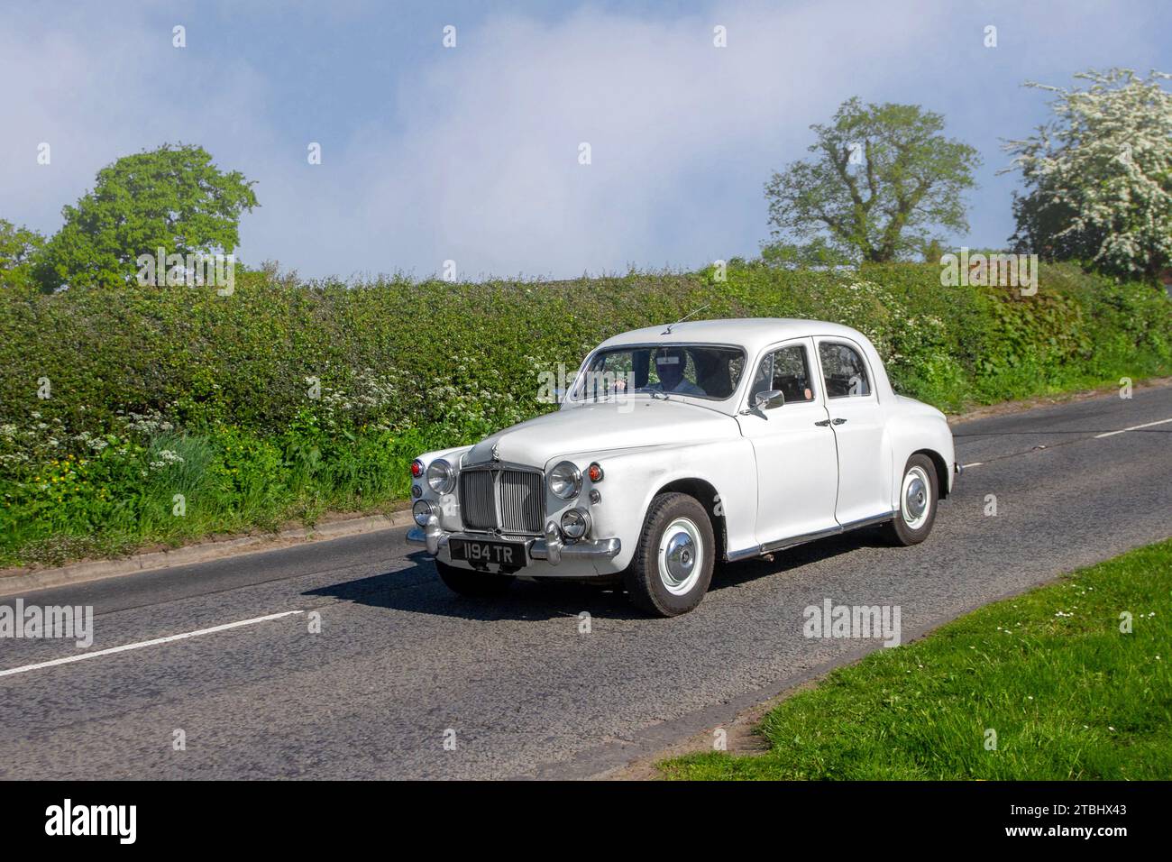 1960 60s sixties White Rover 80 2495cc petrol four door saloon car. Rover P4 series  mid-size luxury saloon cars; Vintage, restored classic motors, automobile collectors motoring enthusiasts, historic veteran cars travelling in Cheshire, UK Stock Photo