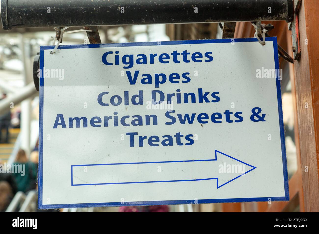 A sign saying Cigarettes Vapes Cold Drinks American Sweets & Treats Stock Photo