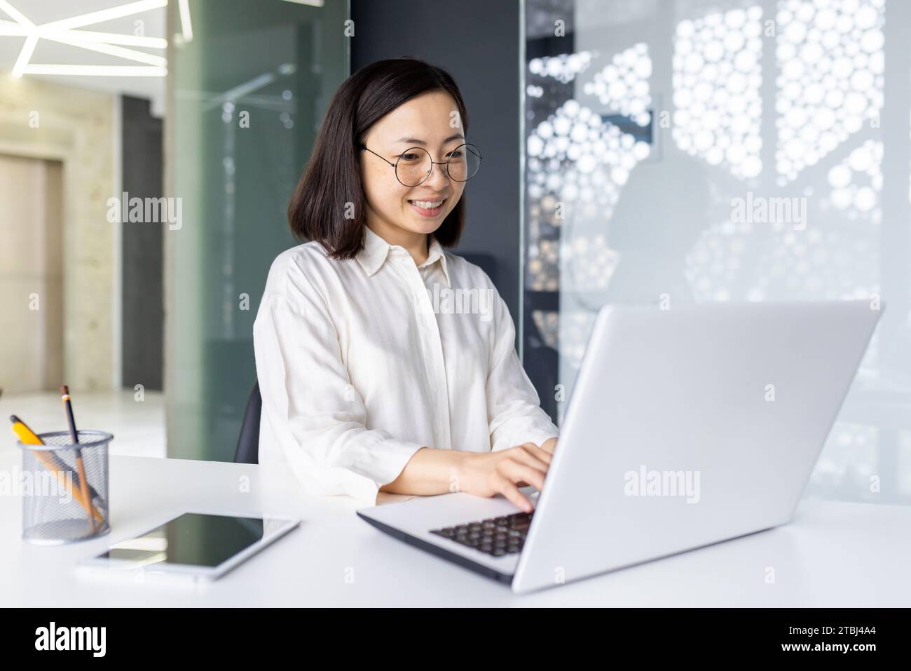 Successful Asian business woman at workplace inside office, female ...