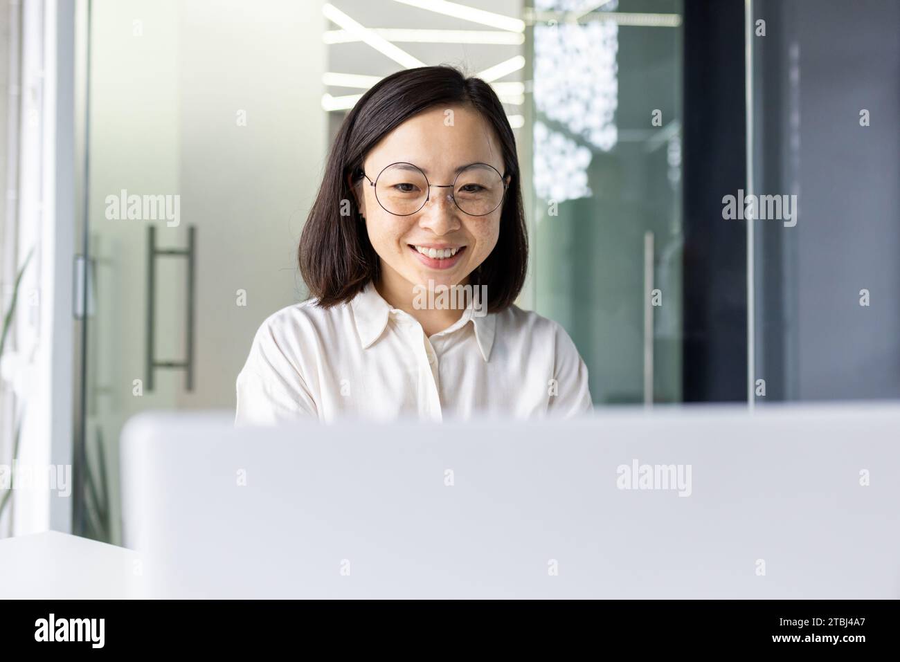 Successful Asian business woman at workplace inside office, female ...