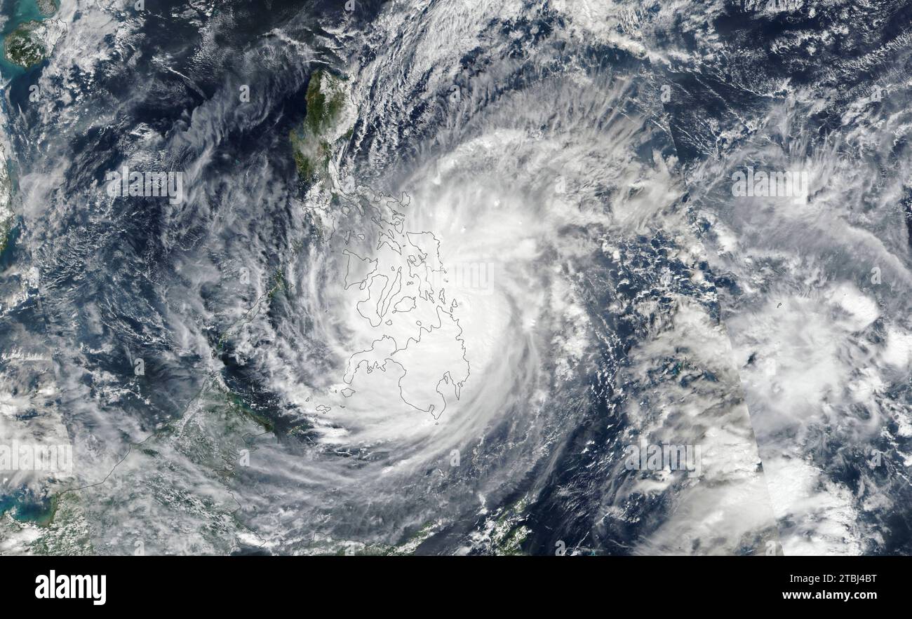 Satellite image of Typhoon Rai crossing the southern and central Philippines. Stock Photo
