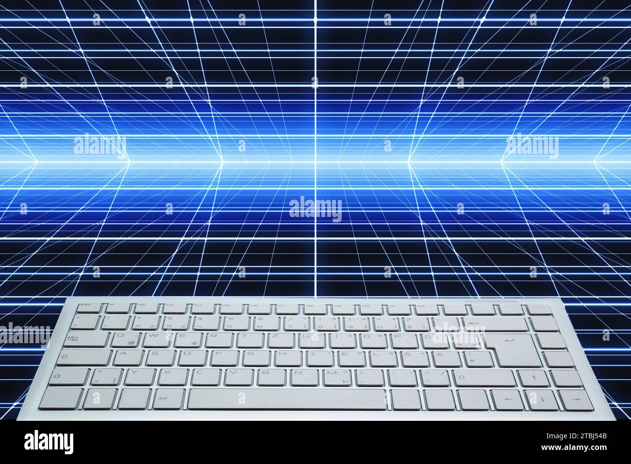 white computer keyboard over a tech background with copy space Stock Photo