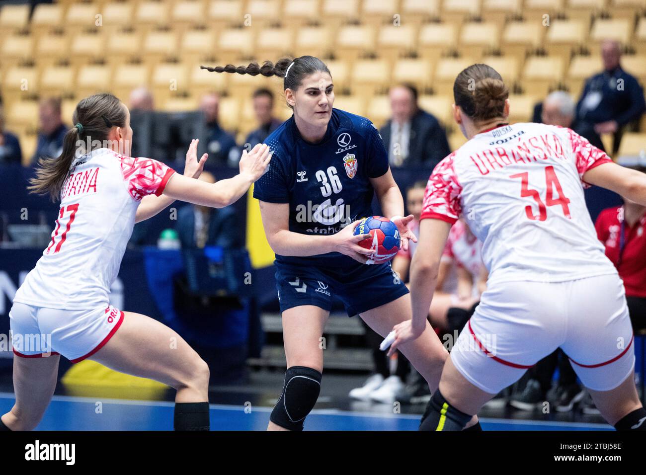 Emilija Lazic of Serbia in action with Adrianna Gorna and Marlena Urbańska of Poland during the IHF World Women's Handball Championship match between Serbia and Poland in the main round group 3 at Arena Nord in Frederikshavn Denmark Thursday Dec. 7, 2023.. (Foto: Bo Amstrup/Ritzau Scanpix) Stock Photo