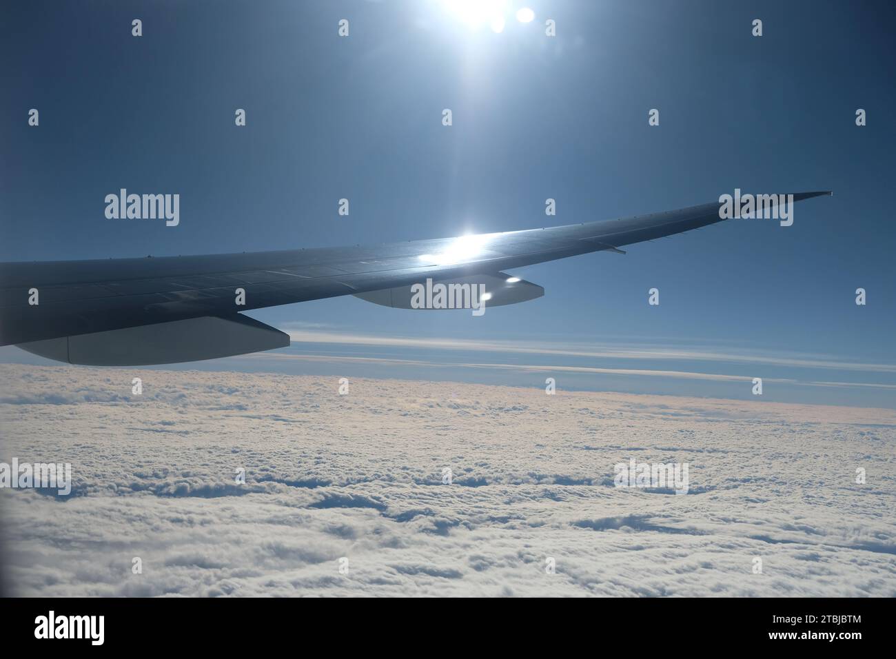 A view of an airplane wing above the clouds Stock Photo - Alamy