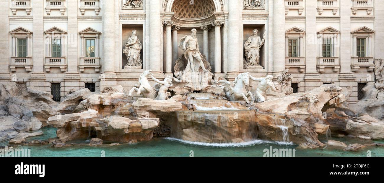 A panoramic view of  Fontana di Trevi, Trevi fountain, sculptures and waterfalls, Rome, Italy. Stock Photo