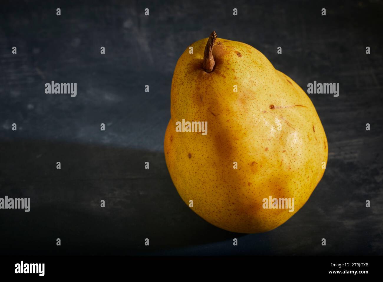 A ripe, raw, yellow pear Stock Photo