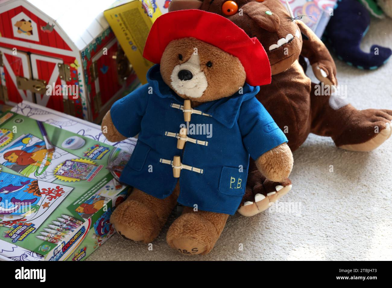The Gruffalo and Paddington Bear teddy bears pictured in a child's bedroom in Chichester, West Sussex, UK. Stock Photo