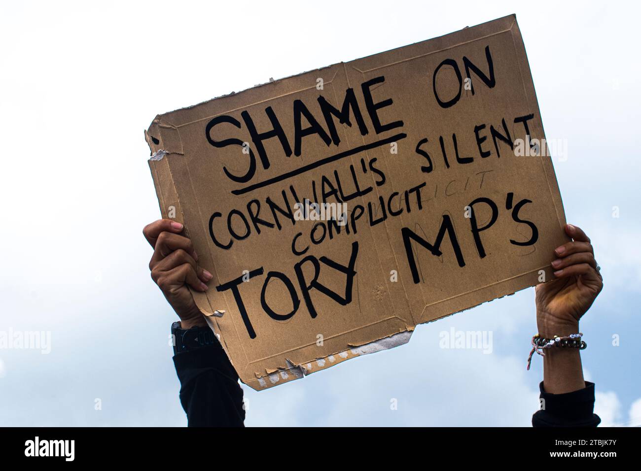 A protest placard referring to the Members of Parliament of Cornwall who are all members of the Conservative party. Stock Photo