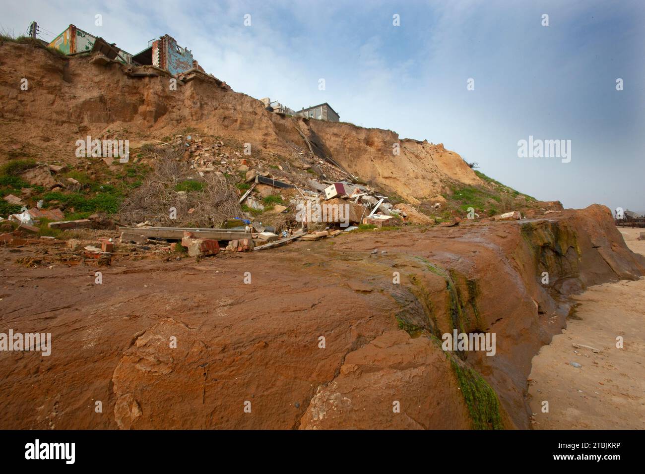 The beach at Happisburgh Norfolk with houses that have fallen into the ...
