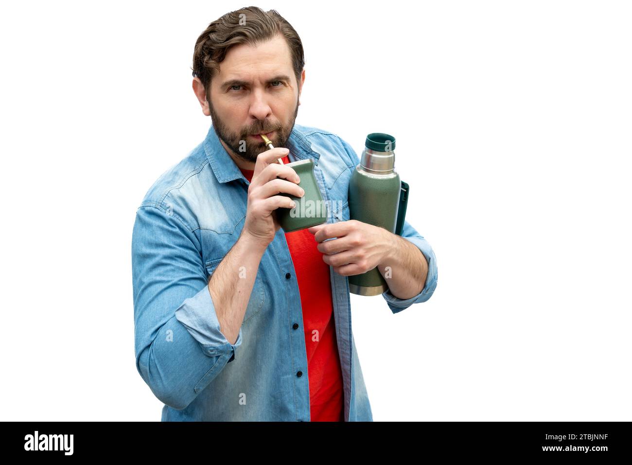 Young adult Argentinian man drinking mate. Stock Photo