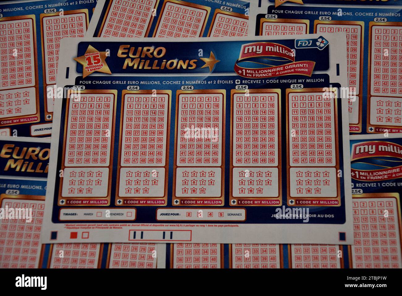 France. 07th Dec, 2023. In this photo illustration, a EuroMillions game slip is placed on top of others. A historic jackpot of 240 million euros will be put into play for the EuroMillions draw on Friday December 8, 2023. This is the largest sum ever put into play since the launch of the lottery in 2004. (Photo by Gerard Bottino/SOPA Images/Sipa USA) *** Strictly for editorial news purposes only *** Credit: Sipa USA/Alamy Live News Stock Photo
