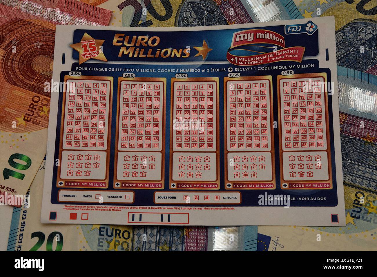 France. 07th Dec, 2023. In this photo illustration, a EuroMillions game slip is placed on euro bank notes. A historic jackpot of 240 million euros will be put into play for the EuroMillions draw on Friday December 8, 2023. This is the largest sum ever put into play since the launch of the lottery in 2004. (Photo by Gerard Bottino/SOPA Images/Sipa USA) *** Strictly for editorial news purposes only *** Credit: Sipa USA/Alamy Live News Stock Photo