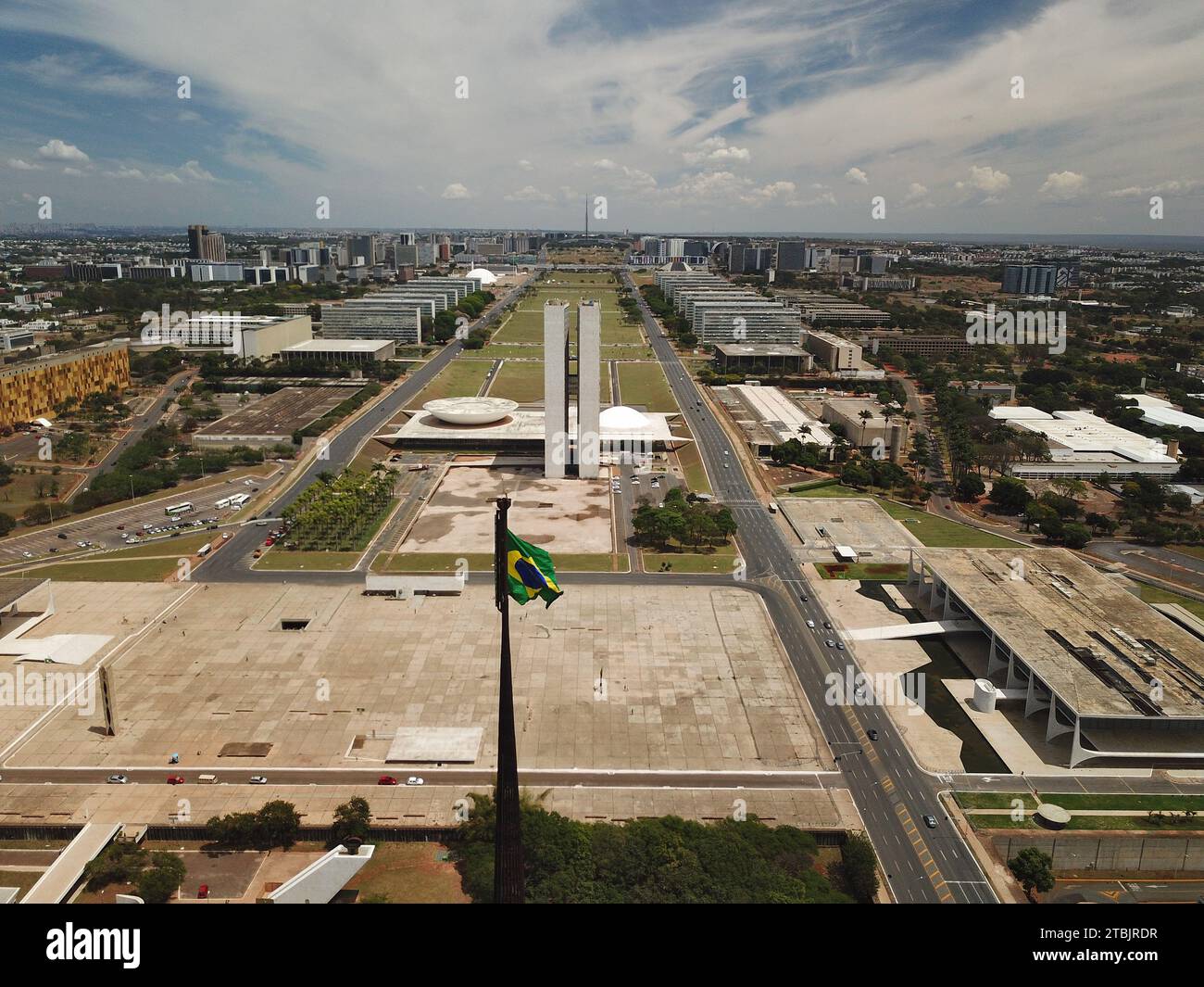 Aerial view of a bustling cityscape featuring a highway and airport ...