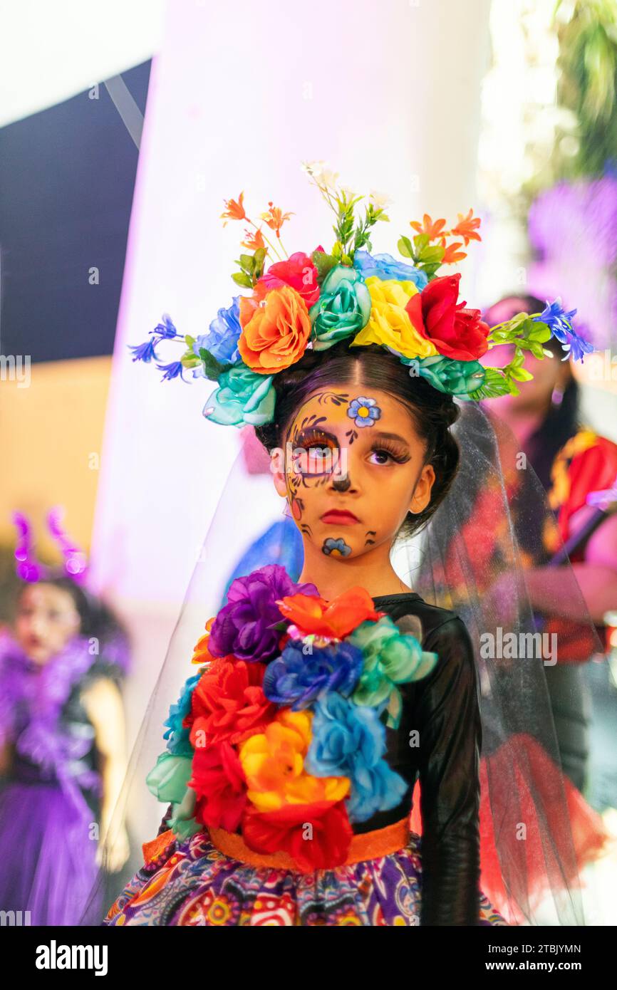 Mexico, Isla Mujures, A young girl dressed  in costume to celebrate the Day of the Dead also known as dia de los Muertos Stock Photo