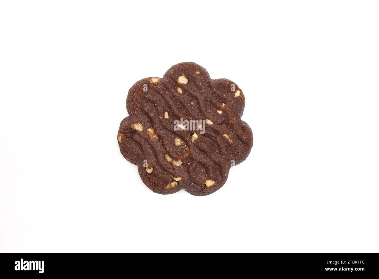One flower shape wavy cocoa and puffed rice biscuit isolated on white ...