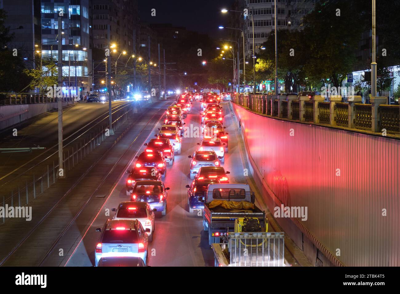 Cars stuck in late evening rush hour traffic in Bucharest, Romania, at an underpass called Pasajul Victoriei. Bucharest, Romania - August 12, 2023. Stock Photo