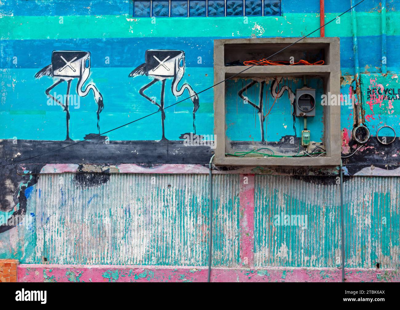 Mexico, Isla Mujeres, street art, flamengos as gas tanks sipping oil Stock Photo