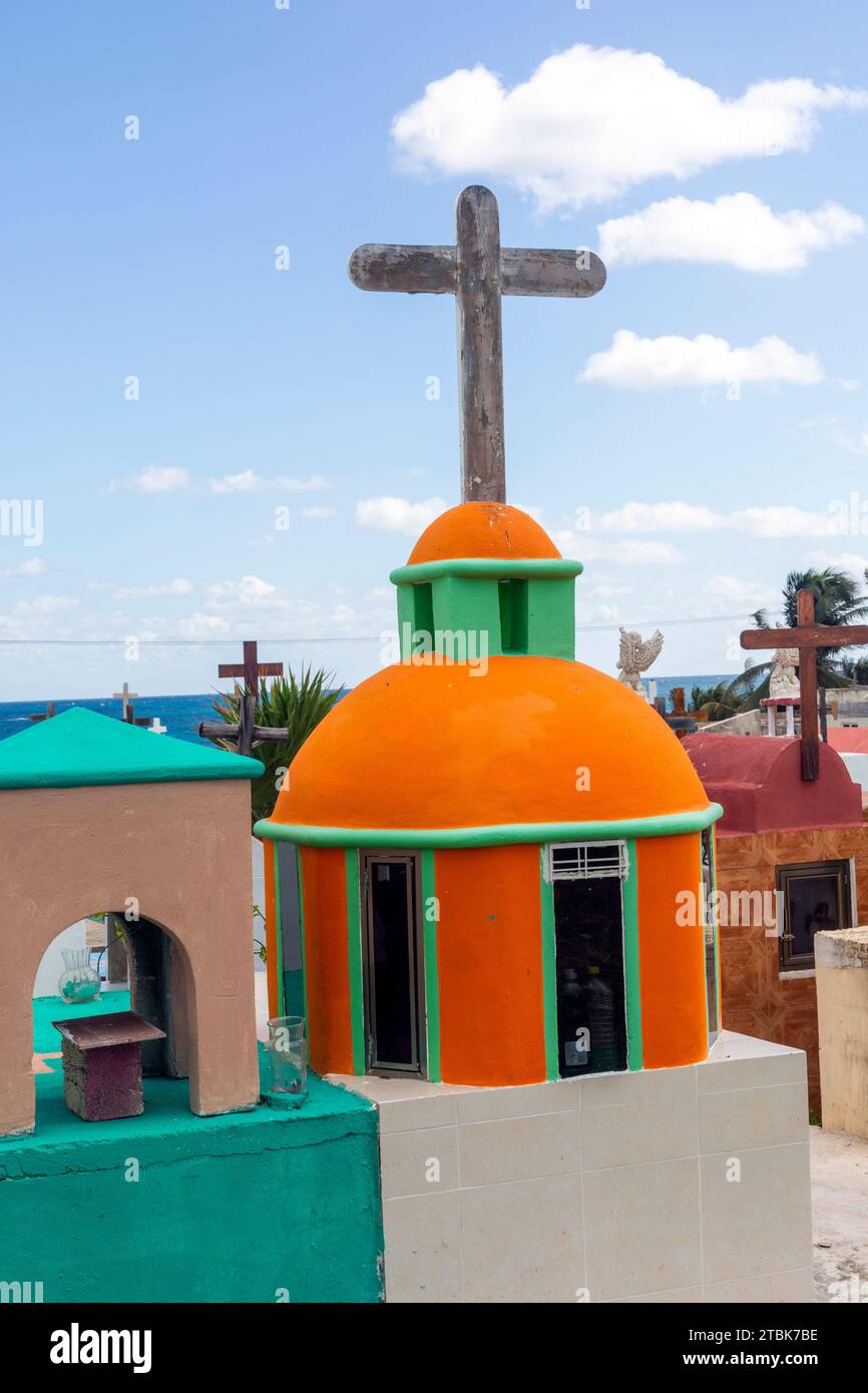 Mexico, Isla Mujeres, the islands main cemetery featuring various  colourful styles of grave markers Stock Photo