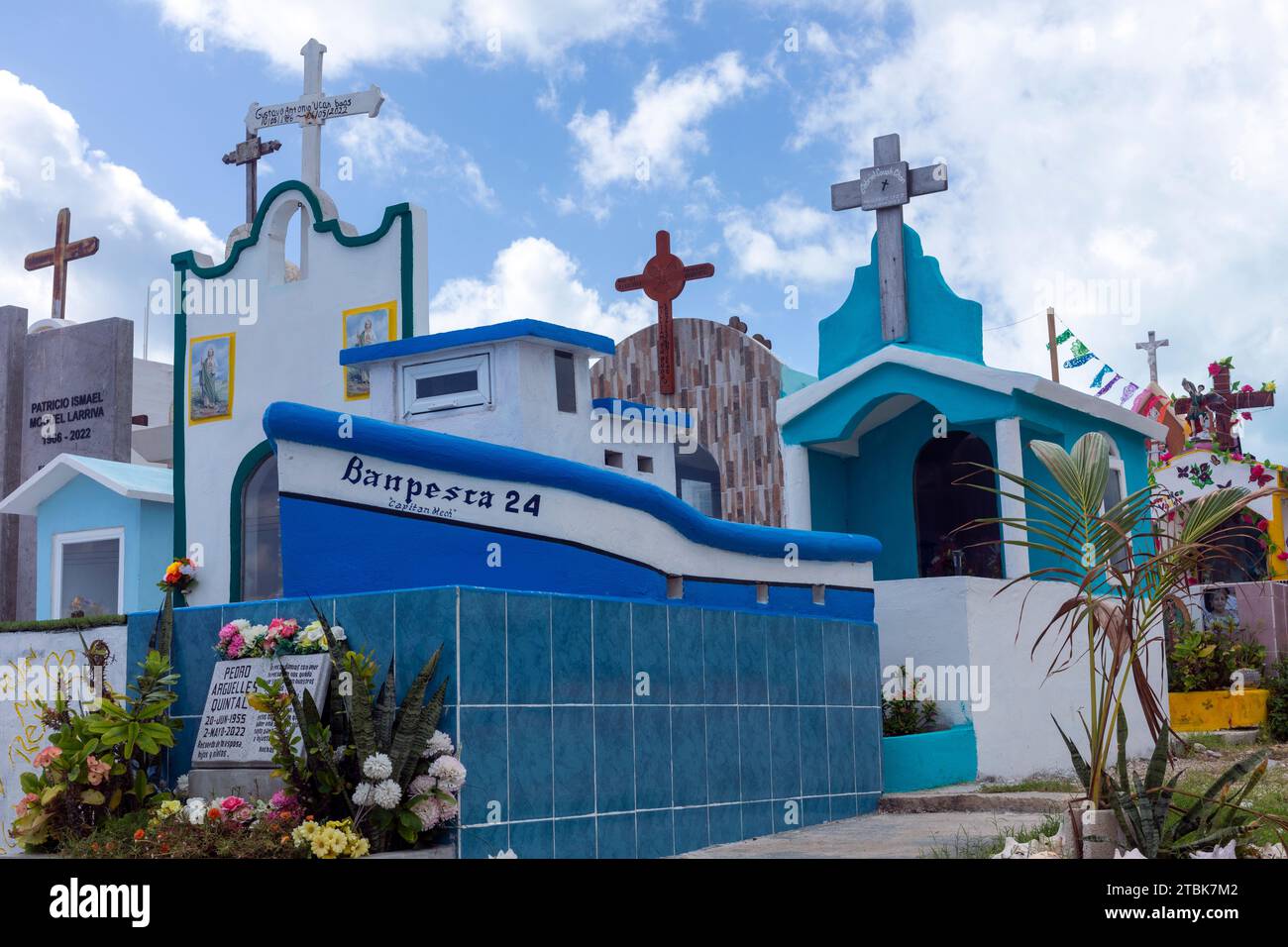 Mexico, Isla Mujeres, the islands main cemetery featuring various  colourful styles of grave markers Stock Photo
