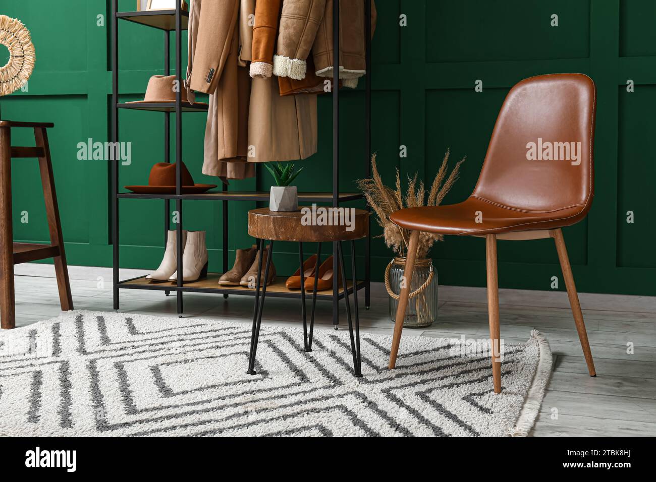 Interior of hall with coat rack and chair Stock Photo - Alamy