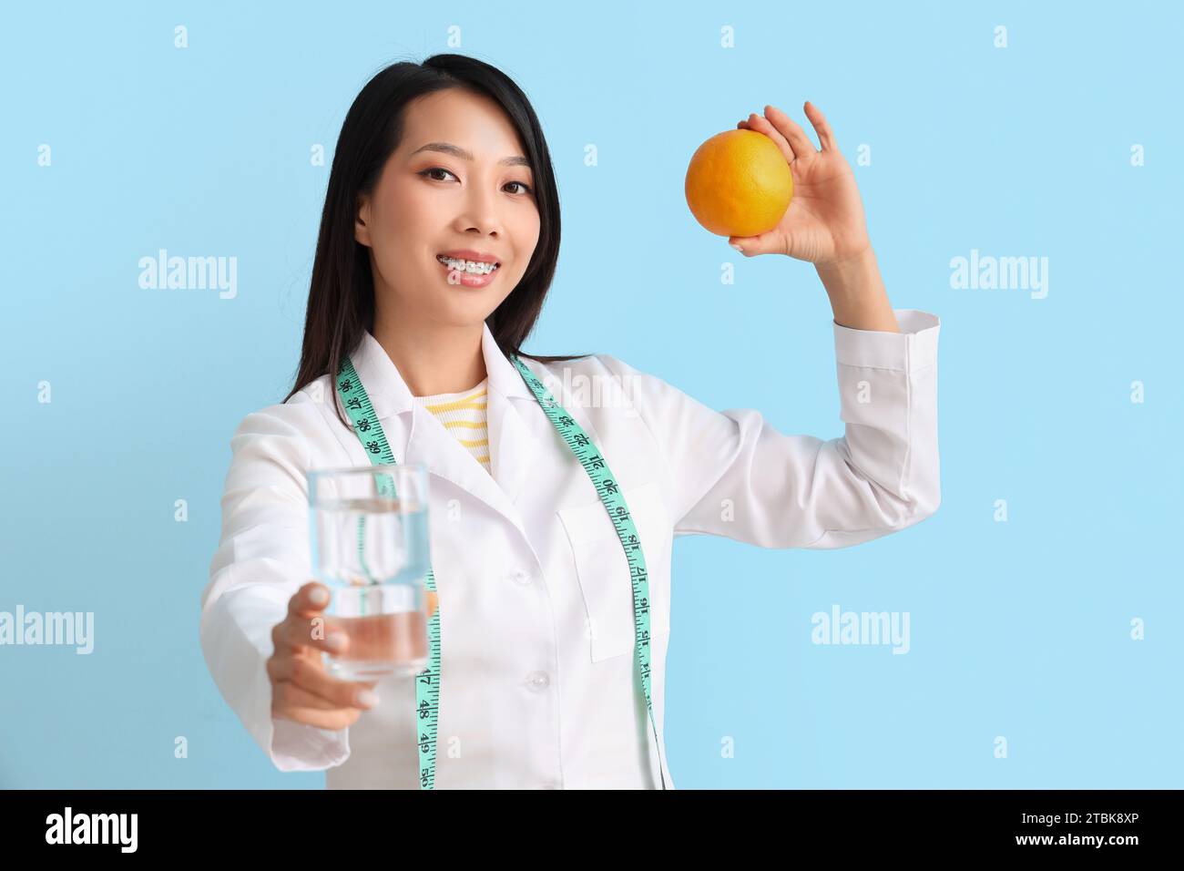 Female asian nutritionist glass hi-res stock photography and images - Alamy